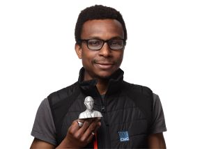 Head of 3D Printing Dr Samuel Wilberforce holding a stainless steel bust of King Charles III to mark the coronation