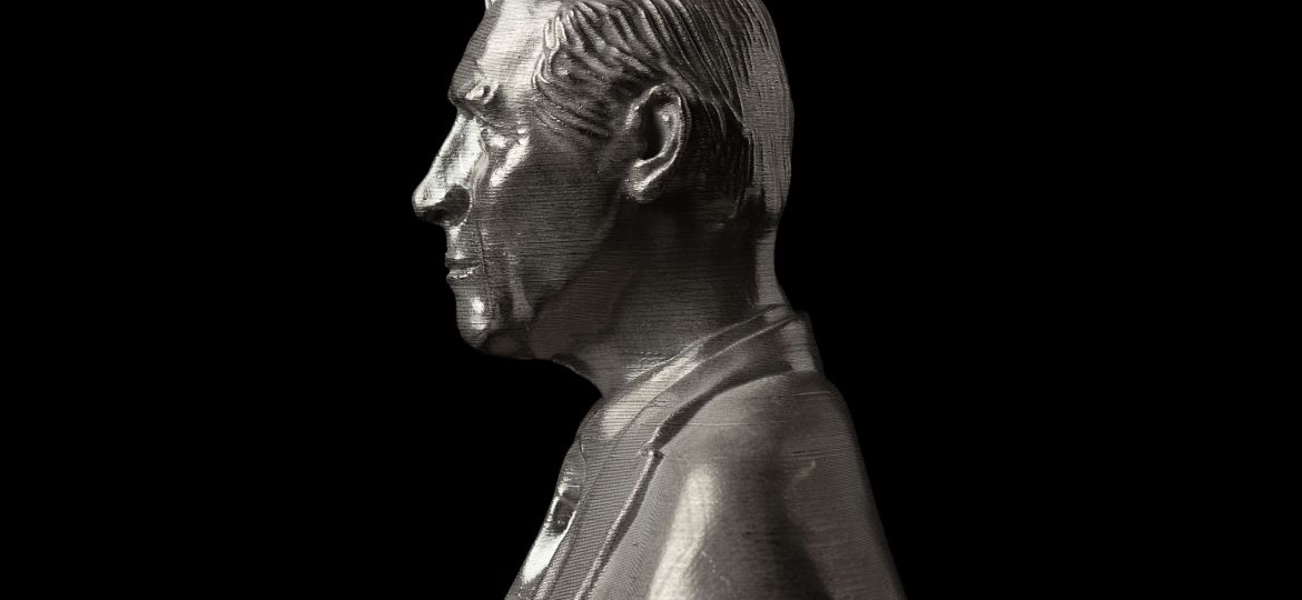 Stainless steel 3D printed bust of King Charles III on a black background to mark his coronation